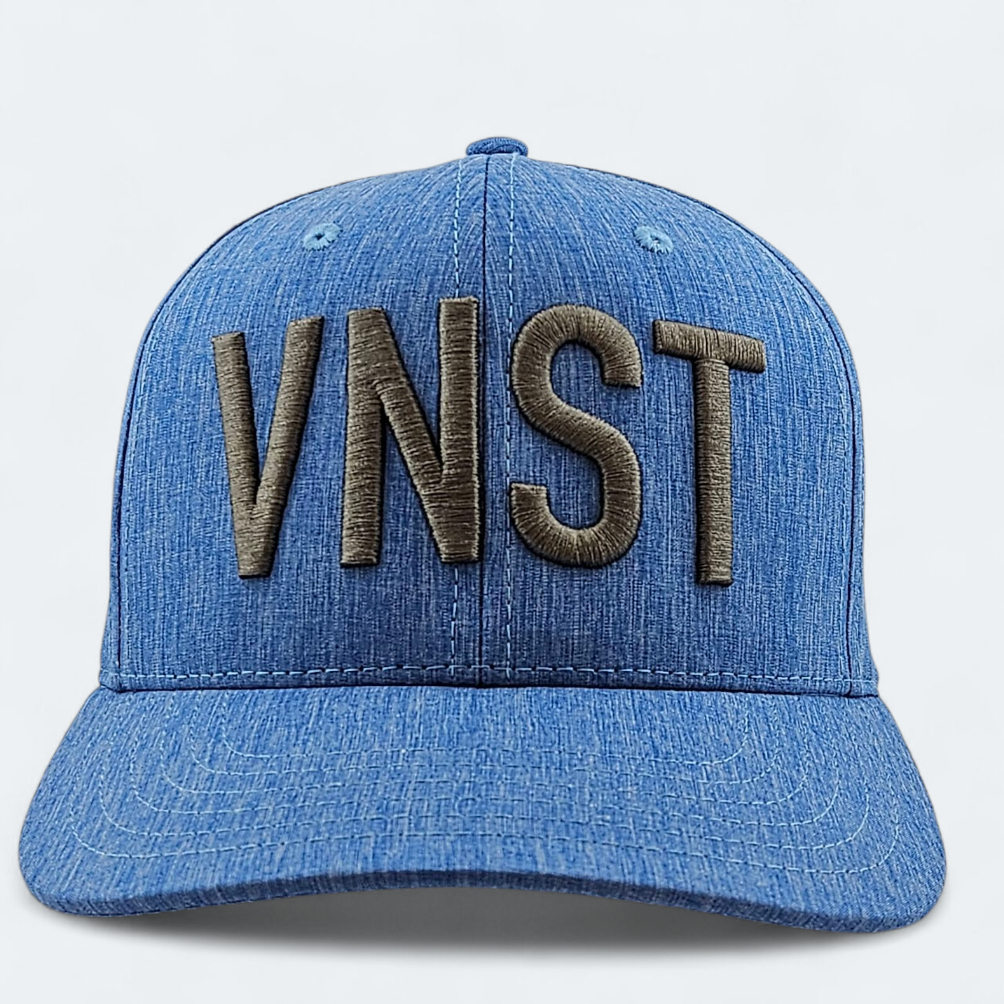 Blue cap with 'VNST' embroidered on a light gray background